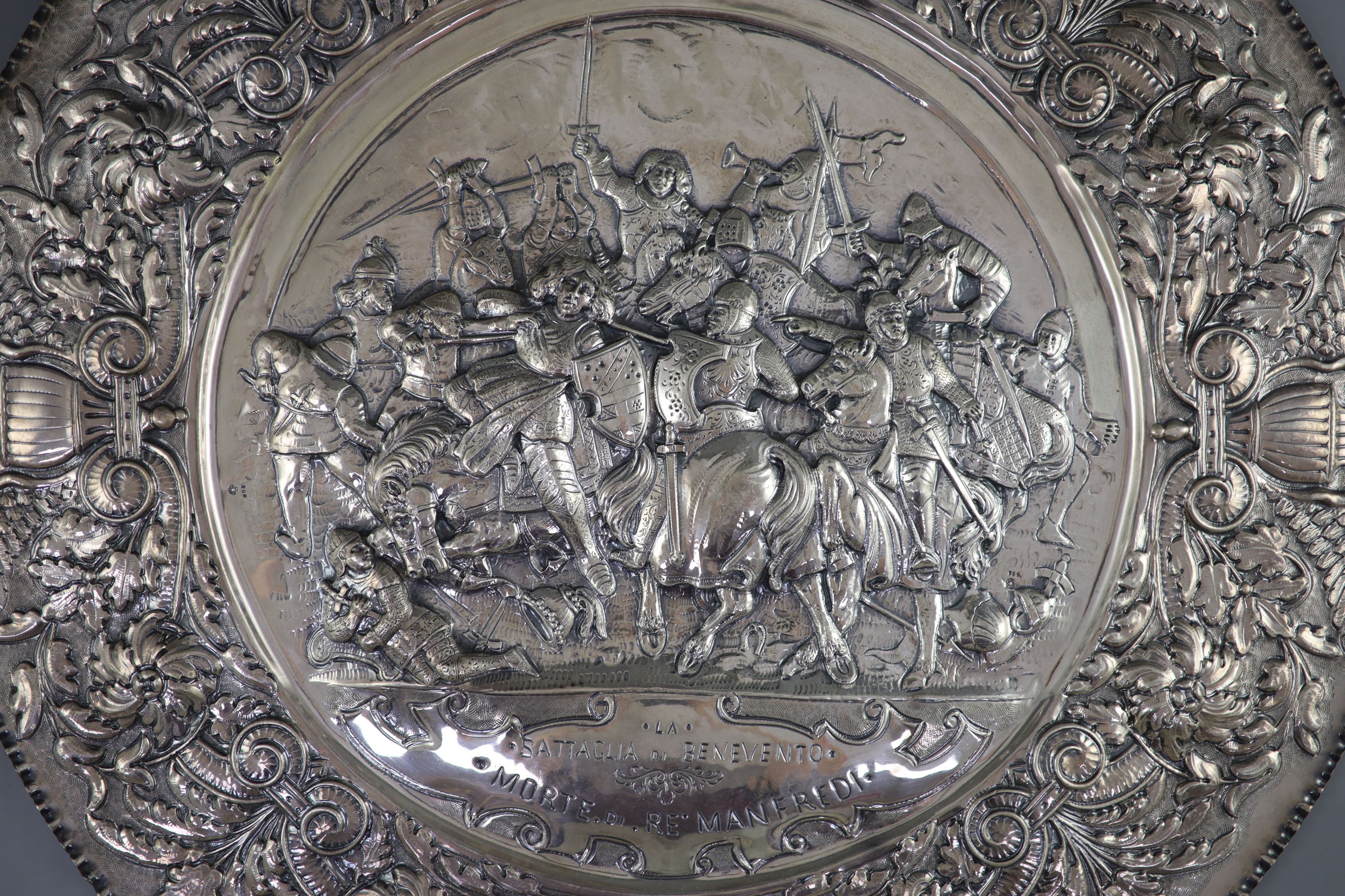 A large late 19th century Italian repousse 800 standard silver charger